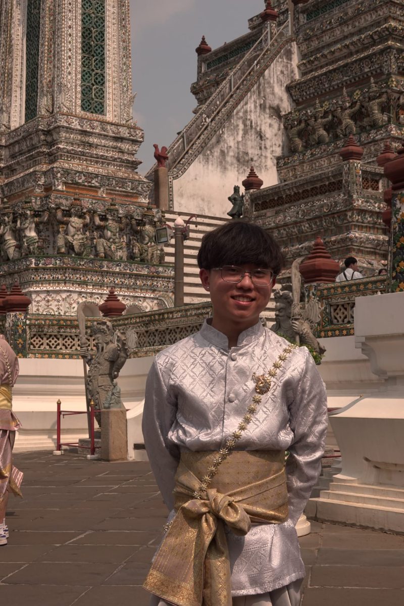 A portrait beside decorated temple columns